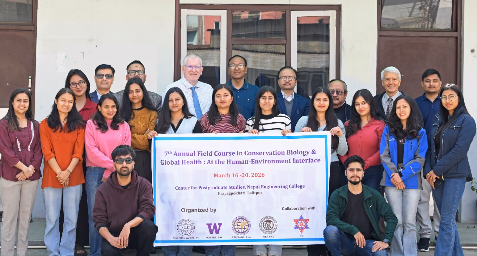 Participants of the college's seventh annual conservation biology field course, banner in front
