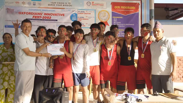 A team in kit holding their medals and a certificate after the college sports week